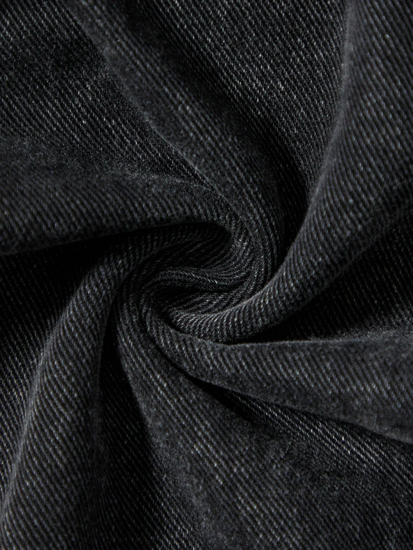 Men's black jeans. With a design of (ripped holes) and tassels. In a street trend style.