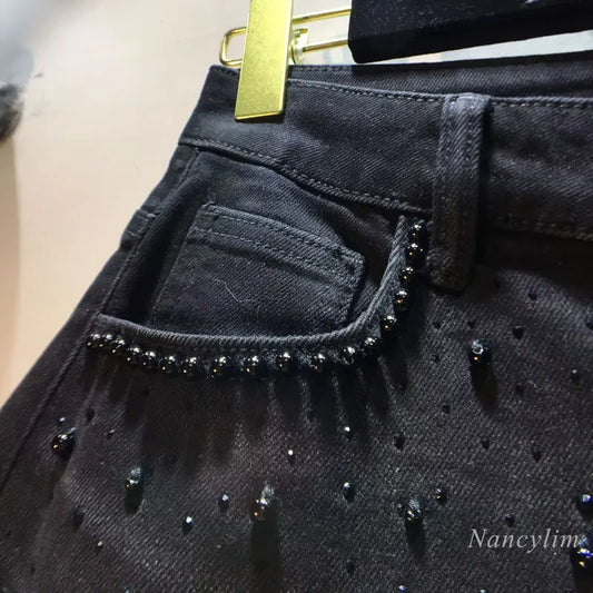 European 2025 Hollow Lace Jeans Women Summer New Black Lace Denim Pants Heavy Industry Beads Hot Diamond Denim Splicing Crochet