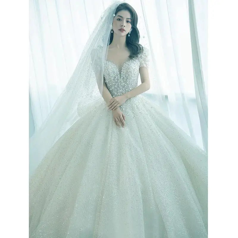 Luxury Short Sleeve Wedding Dress 2026 New Bridal Dress V Neck Beading Shinning Ball Gown Sweep Train Vestido Noiva Customized