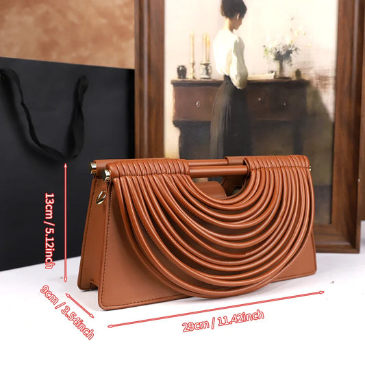 The 2025 new hand-held woven bag with lines is a unique, high-end, individual and fashionable handbag for women
