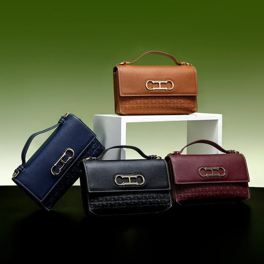 Premium Leather Handbag Monogram Embossing Metallic Clasp Portable Handle Structured Silhouette Ideal Office Evening Events