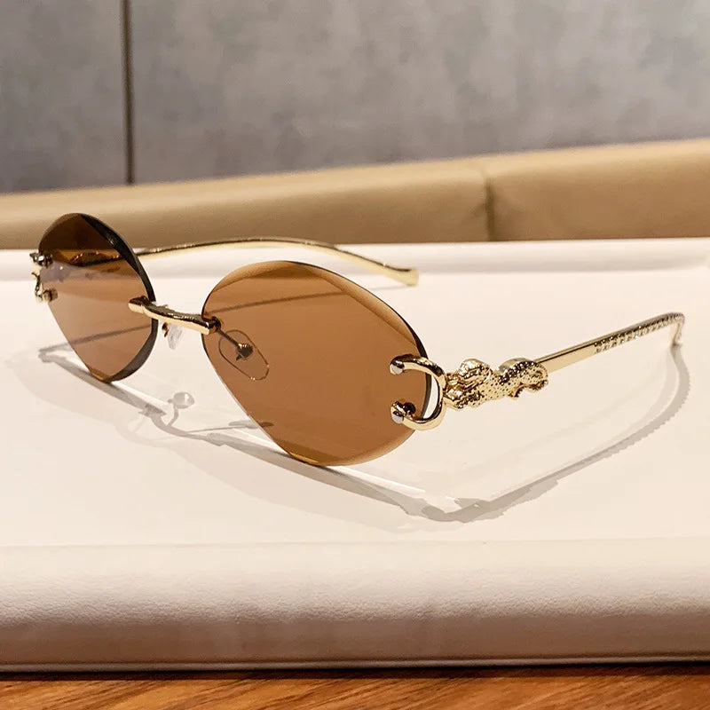 2026 New Fashion Leopard Head Frameless Oval Sunglasses Women Men Internet Celebrity Female Sunscreen Sun Glasses High-end UV400