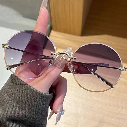 2026 New Fashion rimless circle frame sunglasses for women new alloy oversize gradient knot sun glasses ladies sexy shades uv400