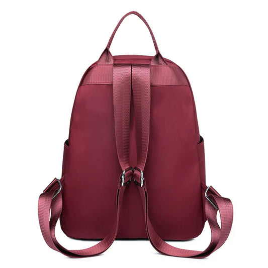 Men's and women's fashionable backpack made of nylon, suitable for travel, tourism and photography. It has multiple pockets.