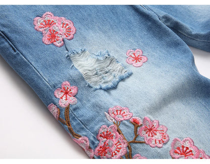 Men Sakura Embroidery Denim Jeans Streetwear Boot Cut Pants Released Hem Flared Trousers with Ripped And Cherry Blossom Design