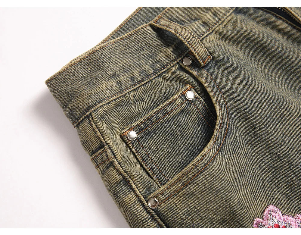 Men Sakura Embroidery Denim Jeans Streetwear Boot Cut Pants Released Hem Flared Trousers with Ripped And Cherry Blossom Design