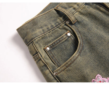 Men Sakura Embroidery Denim Jeans Streetwear Boot Cut Pants Released Hem Flared Trousers with Ripped And Cherry Blossom Design