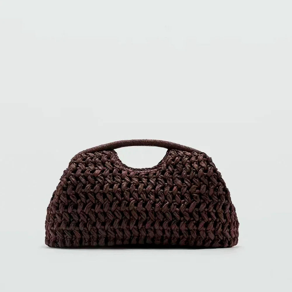 Seaside vacation style grass woven bag, spring and summer new style, European and American high-end feeling, hand-held gold clip
