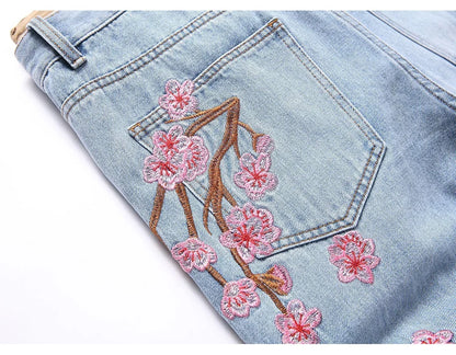 Men Sakura Embroidery Denim Jeans Streetwear Boot Cut Pants Released Hem Flared Trousers with Ripped And Cherry Blossom Design