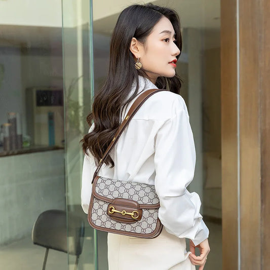 Ladies genuine leather saddle bag, single shoulder bag underarm bag, new fashion versatile niche trend crossbody bag.