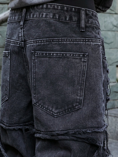 Men's black jeans. With a design of (ripped holes) and tassels. In a street trend style.