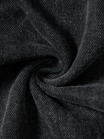 Men's black jeans. With a design of (ripped holes) and tassels. In a street trend style.