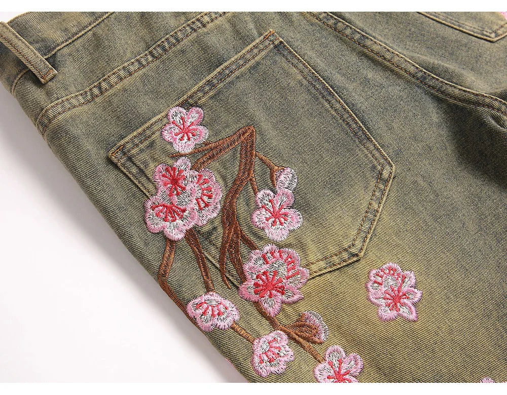 Men Sakura Embroidery Denim Jeans Streetwear Boot Cut Pants Released Hem Flared Trousers with Ripped And Cherry Blossom Design