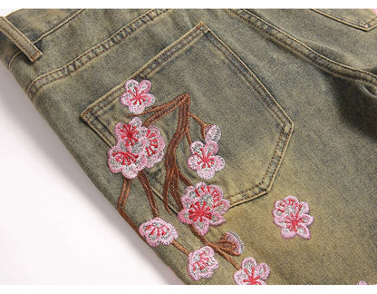 Men Sakura Embroidery Denim Jeans Streetwear Boot Cut Pants Released Hem Flared Trousers with Ripped And Cherry Blossom Design