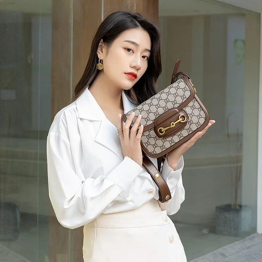 Ladies genuine leather saddle bag, single shoulder bag underarm bag, new fashion versatile niche trend crossbody bag.