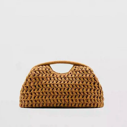 Seaside vacation style grass woven bag, spring and summer new style, European and American high-end feeling, hand-held gold clip