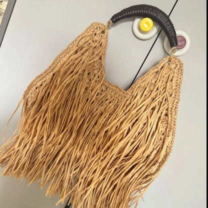 Pure hand-woven women's bags niche design ethnic holiday style straw woven fringed portable shoulder women's bags