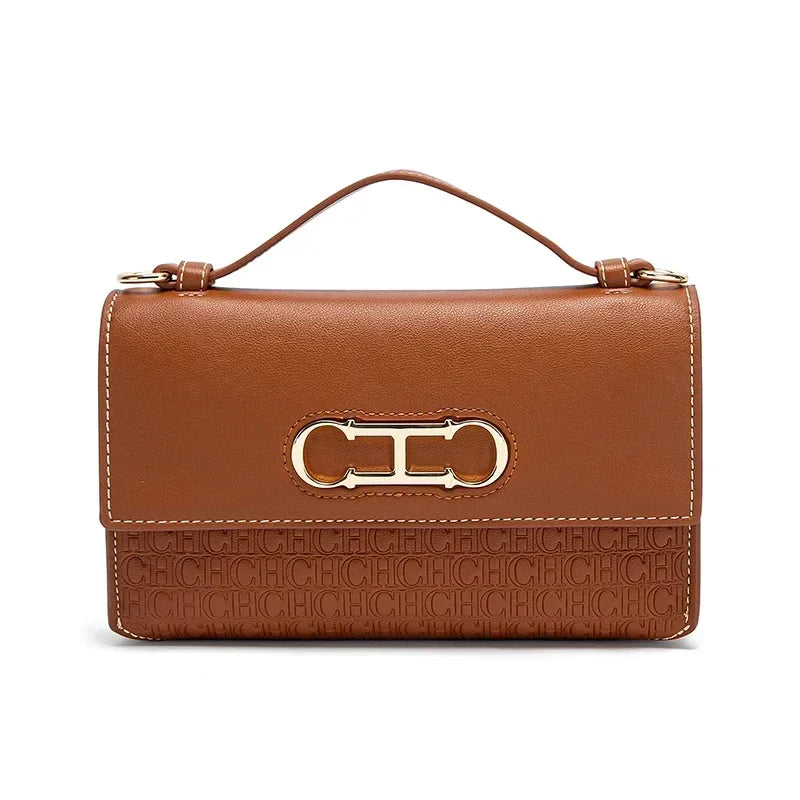 Premium Leather Handbag Monogram Embossing Metallic Clasp Portable Handle Structured Silhouette Ideal Office Evening Events