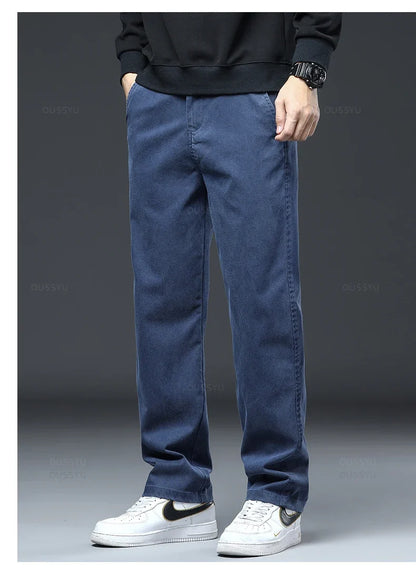 2025 New High Quality Soft Lyocell Fabric Jeans Men Elastic Waist Loose Straight Four Seasons Denim Trousers Male Plus Size 5XL