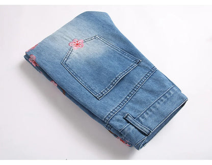 Men Sakura Embroidery Denim Jeans Streetwear Boot Cut Pants Released Hem Flared Trousers with Ripped And Cherry Blossom Design