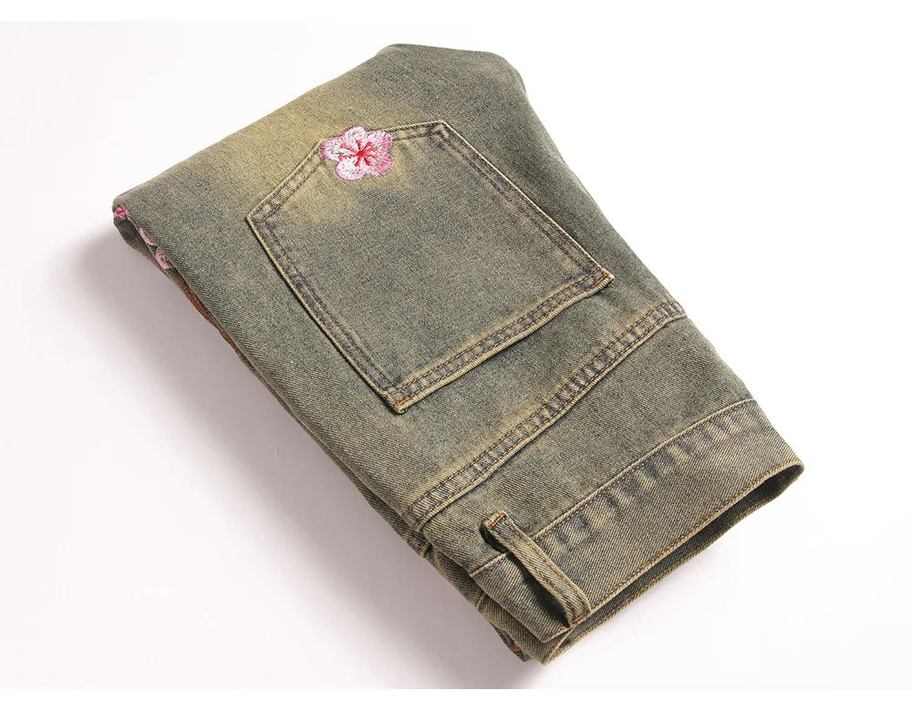 Men Sakura Embroidery Denim Jeans Streetwear Boot Cut Pants Released Hem Flared Trousers with Ripped And Cherry Blossom Design