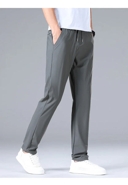 High Quality Ice Silk Stretch New Brand Casual Fashion Elastic Strappy Long Pants Street Style Pencil Teens Trousers Men Clothes