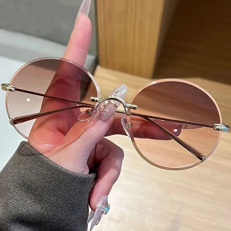 2026 New Fashion rimless circle frame sunglasses for women new alloy oversize gradient knot sun glasses ladies sexy shades uv400