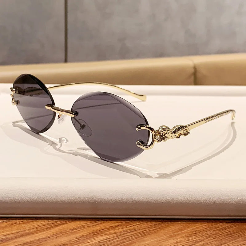 2026 New Fashion Leopard Head Frameless Oval Sunglasses Women Men Internet Celebrity Female Sunscreen Sun Glasses High-end UV400