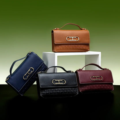 Premium Leather Handbag Monogram Embossing Metallic Clasp Portable Handle Structured Silhouette Ideal Office Evening Events