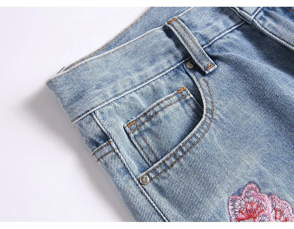 Men Sakura Embroidery Denim Jeans Streetwear Boot Cut Pants Released Hem Flared Trousers with Ripped And Cherry Blossom Design