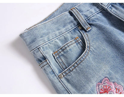 Men Sakura Embroidery Denim Jeans Streetwear Boot Cut Pants Released Hem Flared Trousers with Ripped And Cherry Blossom Design