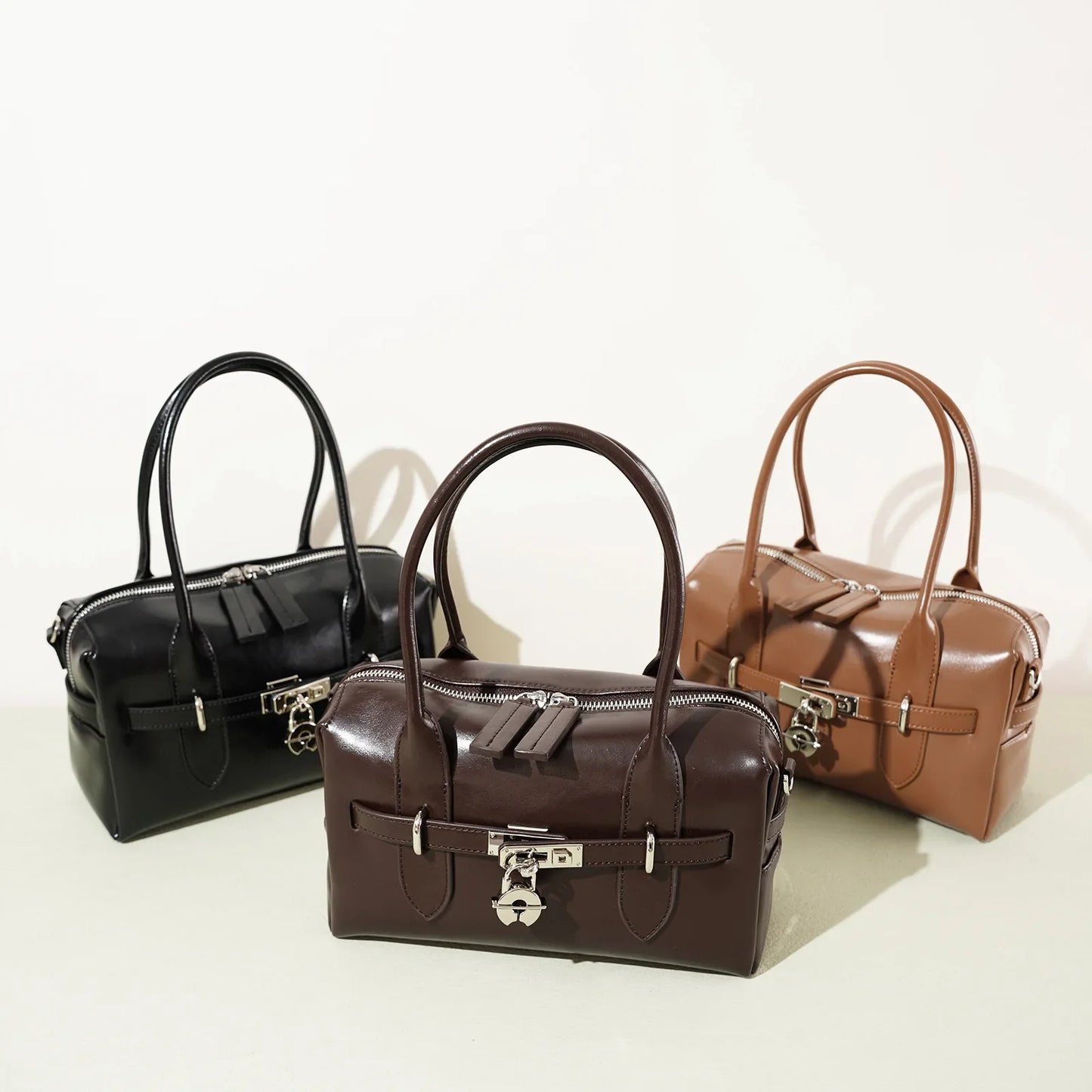 2025 Fall Winter New Top Grain Leather Spacious Boston Bag Lock Design Single Shoulder Crossbody Pack Women Commuting Handbag
