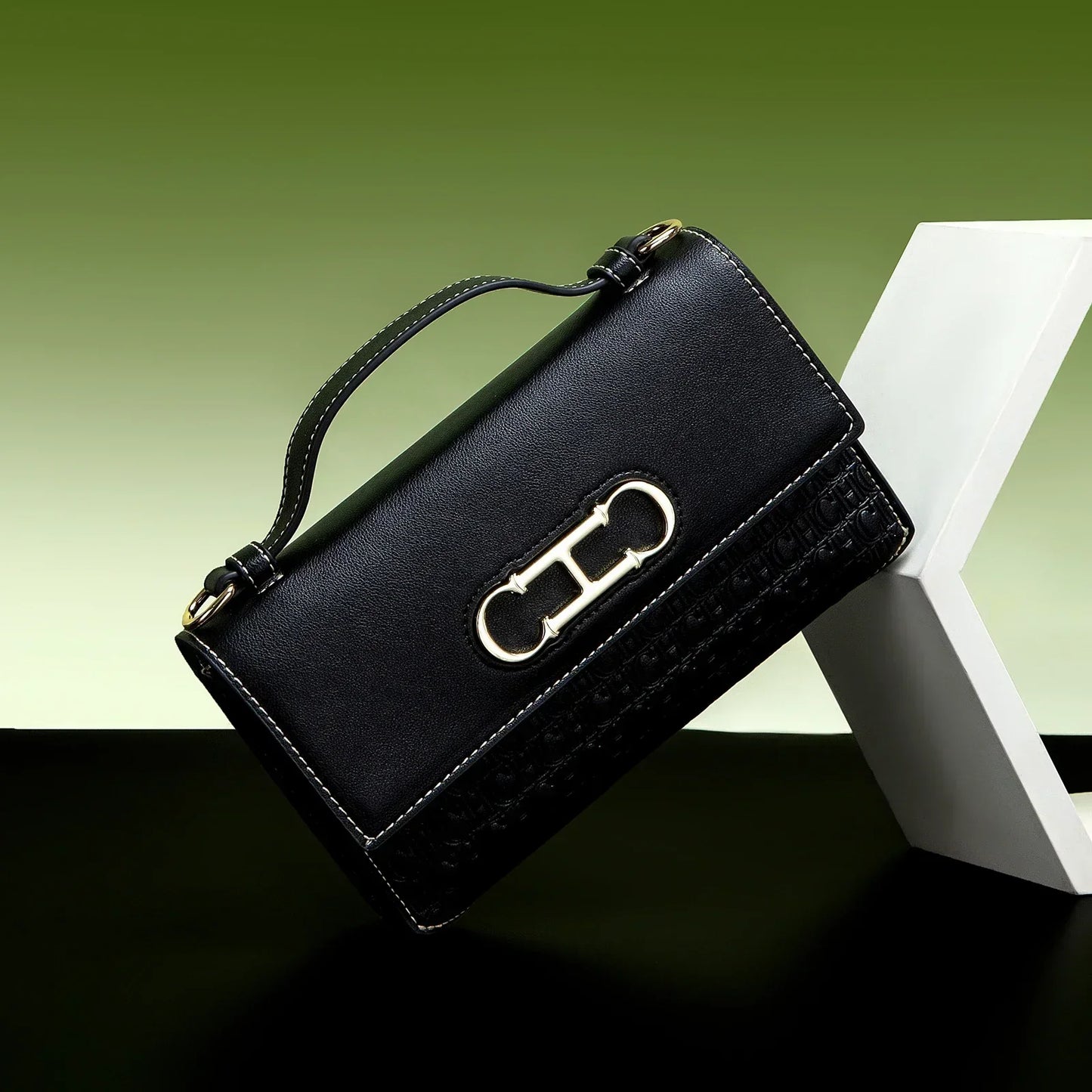 Premium Leather Handbag Monogram Embossing Metallic Clasp Portable Handle Structured Silhouette Ideal Office Evening Events