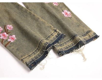 Men Sakura Embroidery Denim Jeans Streetwear Boot Cut Pants Released Hem Flared Trousers with Ripped And Cherry Blossom Design