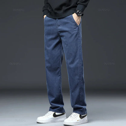 2025 New High Quality Soft Lyocell Fabric Jeans Men Elastic Waist Loose Straight Four Seasons Denim Trousers Male Plus Size 5XL