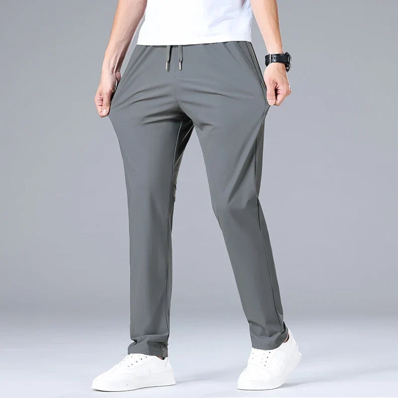High Quality Ice Silk Stretch New Brand Casual Fashion Elastic Strappy Long Pants Street Style Pencil Teens Trousers Men Clothes