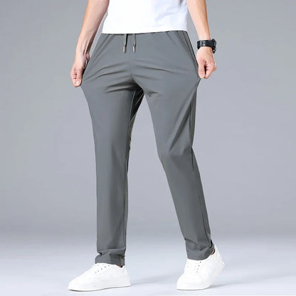 High Quality Ice Silk Stretch New Brand Casual Fashion Elastic Strappy Long Pants Street Style Pencil Teens Trousers Men Clothes