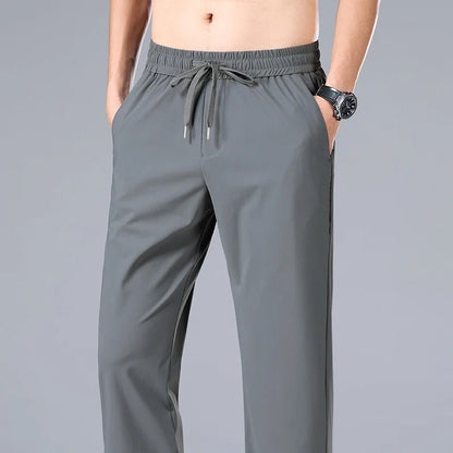 High Quality Ice Silk Stretch New Brand Casual Fashion Elastic Strappy Long Pants Street Style Pencil Teens Trousers Men Clothes