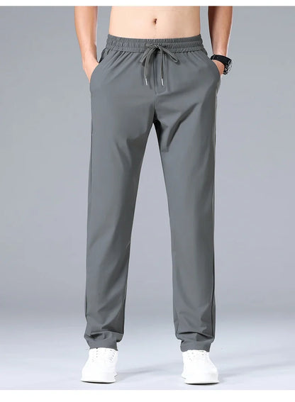 High Quality Ice Silk Stretch New Brand Casual Fashion Elastic Strappy Long Pants Street Style Pencil Teens Trousers Men Clothes