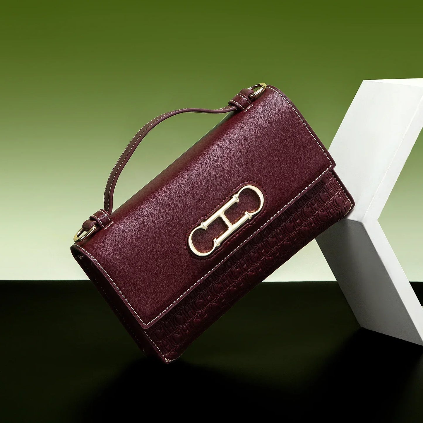 Premium Leather Handbag Monogram Embossing Metallic Clasp Portable Handle Structured Silhouette Ideal Office Evening Events