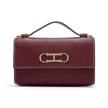 Premium Leather Handbag Monogram Embossing Metallic Clasp Portable Handle Structured Silhouette Ideal Office Evening Events