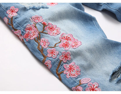 Men Sakura Embroidery Denim Jeans Streetwear Boot Cut Pants Released Hem Flared Trousers with Ripped And Cherry Blossom Design