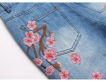 Men Sakura Embroidery Denim Jeans Streetwear Boot Cut Pants Released Hem Flared Trousers with Ripped And Cherry Blossom Design