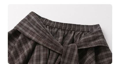 CHIC VEN تنانير نسائية بتصميم A-Line بخصر مطاطي وأربطة معقودة بتصميم كاروهات غير منتظم وتنورة نصف طول تنورة نسائية قصيرة لصيف 2025