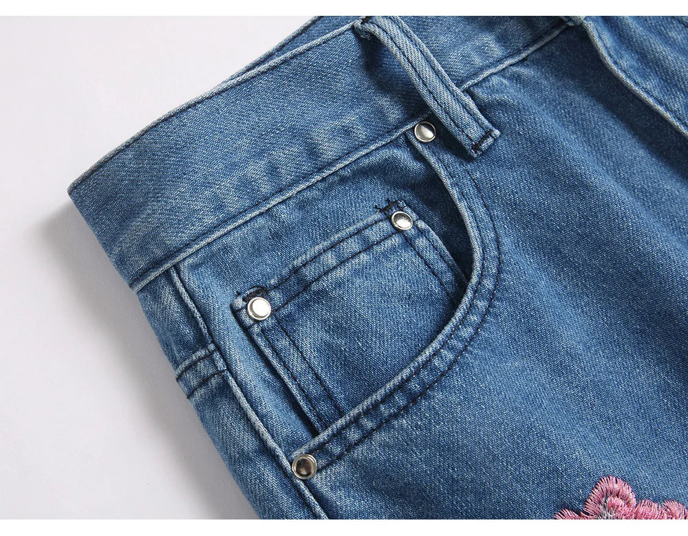 Men Sakura Embroidery Denim Jeans Streetwear Boot Cut Pants Released Hem Flared Trousers with Ripped And Cherry Blossom Design