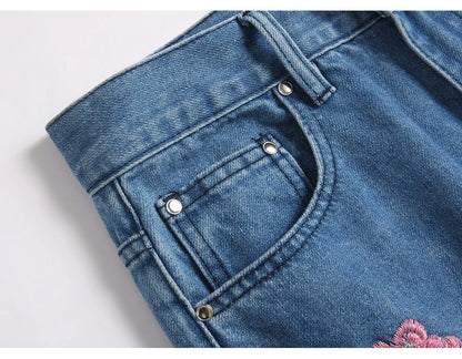 Men Sakura Embroidery Denim Jeans Streetwear Boot Cut Pants Released Hem Flared Trousers with Ripped And Cherry Blossom Design